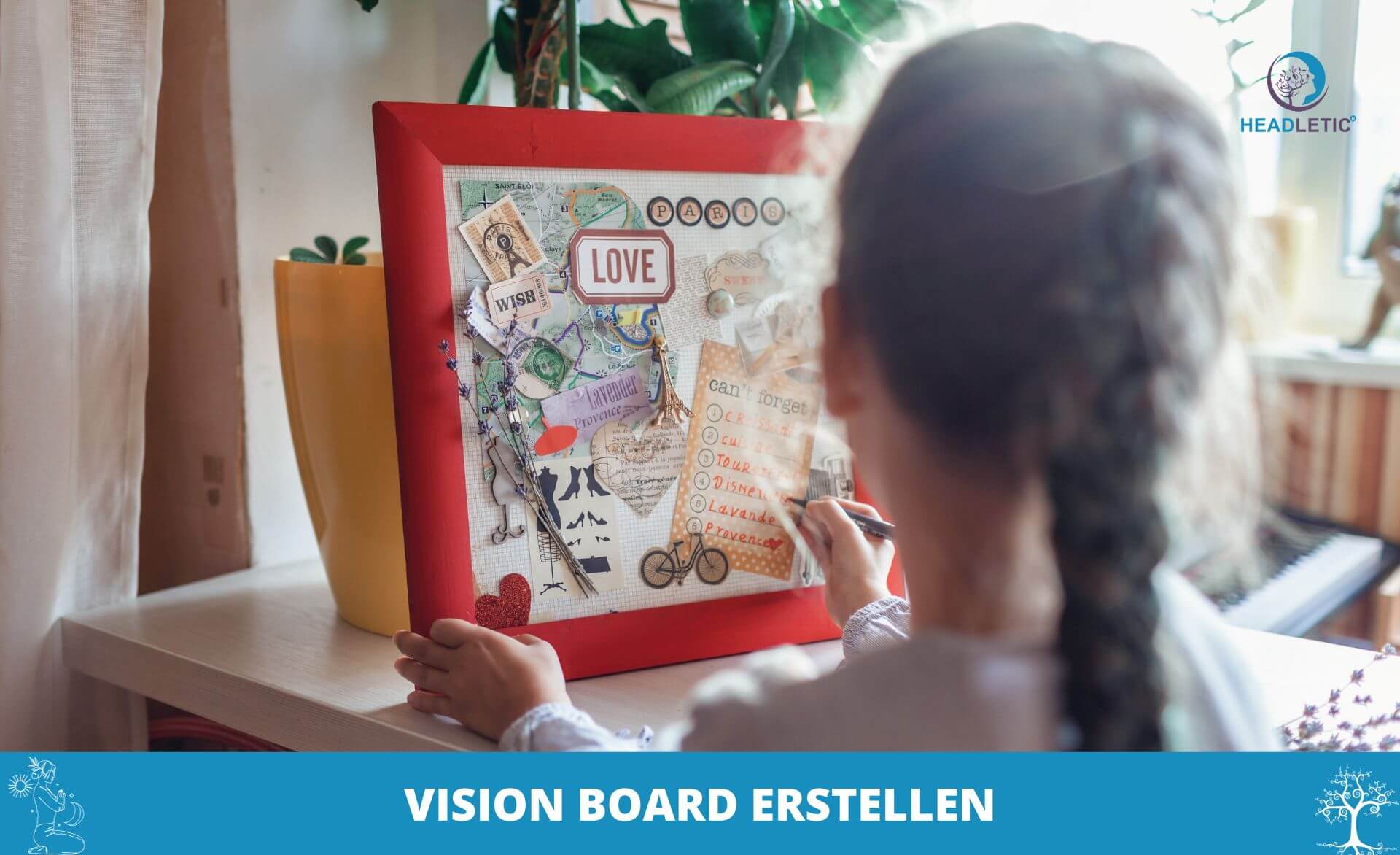 Ein Mädchen erstellt an einem Tisch ein Vision Board mithilfe eines Vision Board-Arbeitsbuchs.